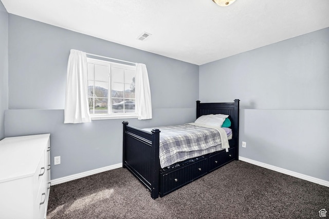 811 S Park Ave W, Logan, UT 84321 - bedroom featuring baseboards, dark colored carpet, and visible vents