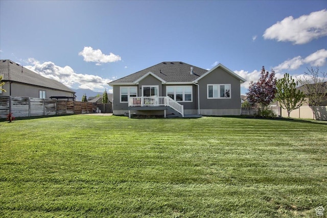 3159 N 1100 W, Pleasant View, UT 84414 - rear view of property with a yard and a fenced backyard