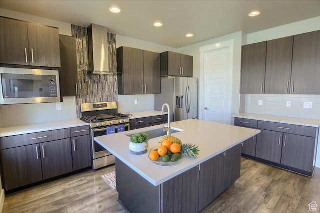 3159 N 1100 W, Pleasant View, UT 84414 - kitchen featuring a sink, light countertops, wall chimney exhaust hood, stainless steel appliances, and backsplash