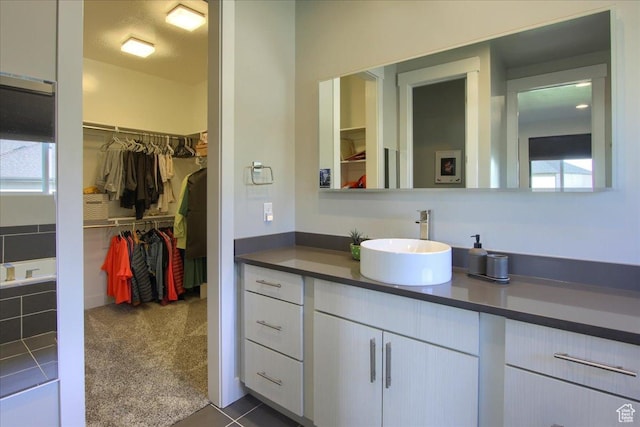 3159 N 1100 W, Pleasant View, UT 84414 - bathroom featuring vanity, plenty of natural light, and a spacious closet
