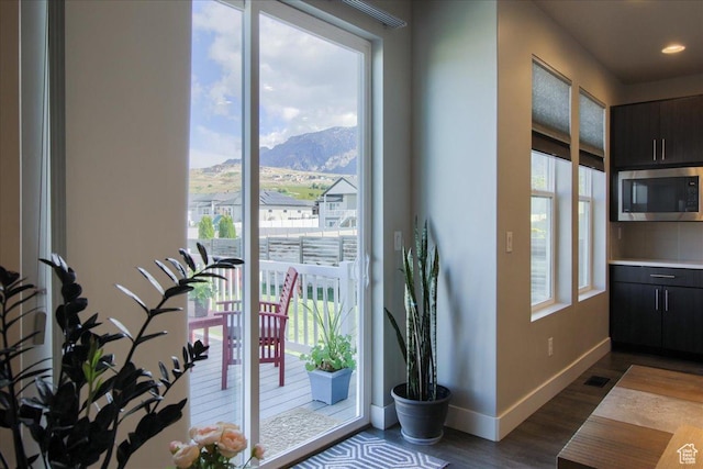 3159 N 1100 W, Pleasant View, UT 84414 - doorway to outside with recessed lighting, baseboards, dark wood-style flooring, and a mountain view