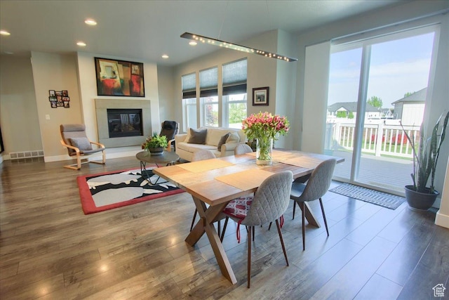 3159 N 1100 W, Pleasant View, UT 84414 - dining room with recessed lighting, baseboards, a glass covered fireplace, and wood finished floors