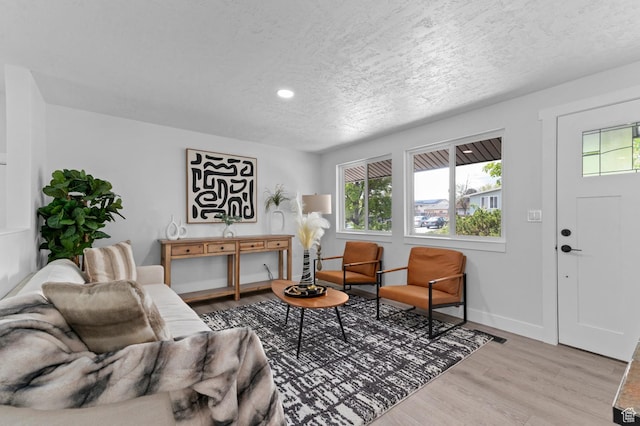 8671 S 3780 W, West Jordan, UT 84088 - living area with recessed lighting, baseboards, light wood-type flooring, and a textured ceiling