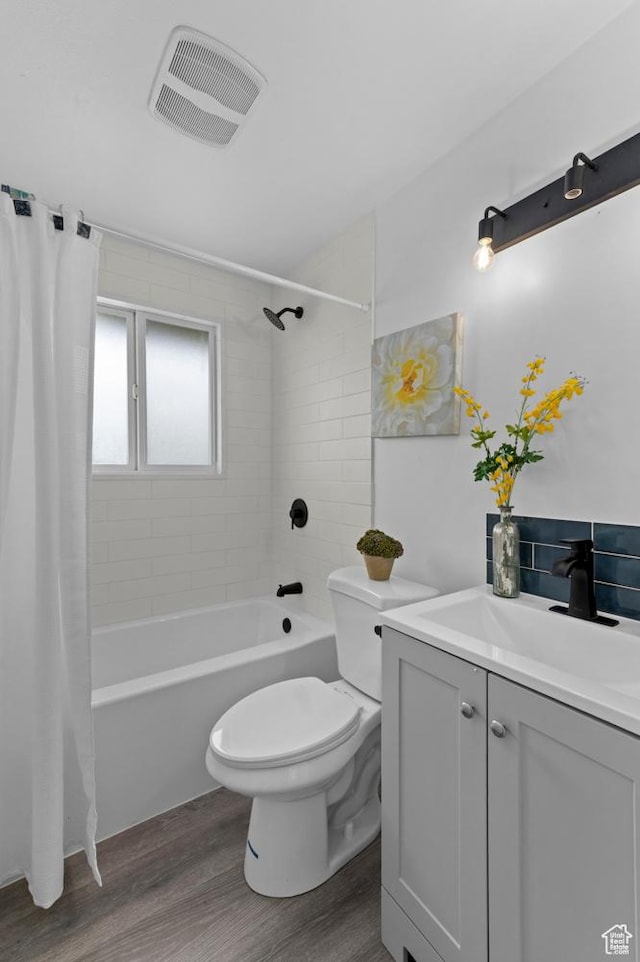 8671 S 3780 W, West Jordan, UT 84088 - full bath with vanity, toilet, wood finished floors, shower / tub combo, and visible vents