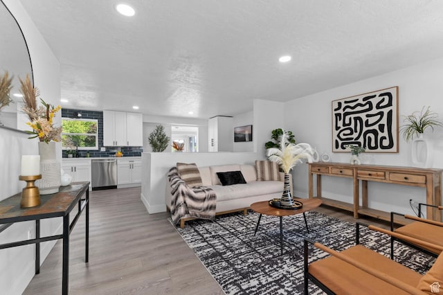 8671 S 3780 W, West Jordan, UT 84088 - living room featuring recessed lighting, light wood finished floors, and a textured ceiling