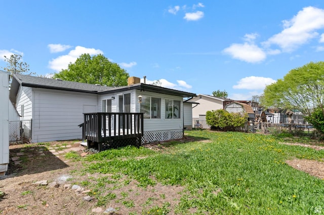 8671 S 3780 W, West Jordan, UT 84088 - rear view of house with fence, a wooden deck, a chimney, and a yard