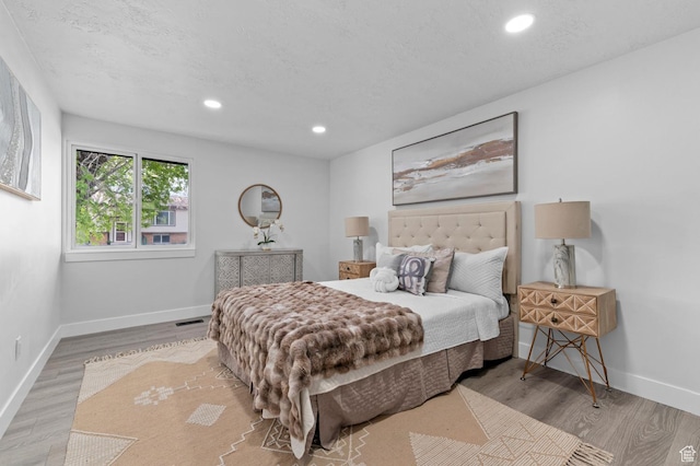 8671 S 3780 W, West Jordan, UT 84088 - bedroom featuring recessed lighting, baseboards, and wood finished floors