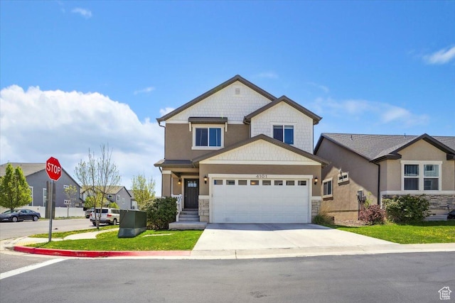 view of front of house with an attached garage, stone siding, and concrete driveway