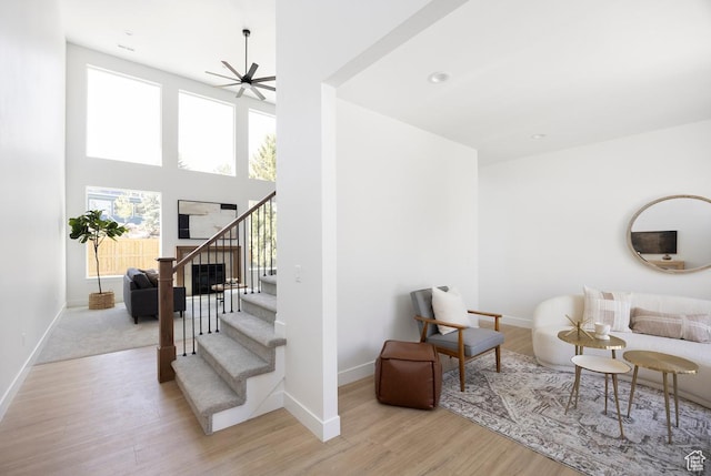 4760 S Millrace Ln, Murray, UT 84107 - living area with stairway, baseboards, a ceiling fan, and wood finished floors
