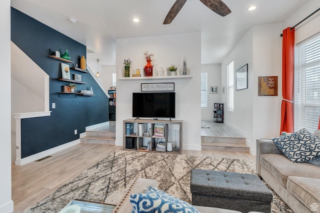 living area featuring ceiling fan, visible vents, wood finished floors, baseboards, and recessed lighting