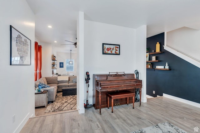 interior space featuring baseboards, a ceiling fan, recessed lighting, and wood finished floors