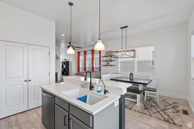 5233 W Linley Ct, Herriman, UT 84096 - kitchen featuring gray cabinets, stainless steel dishwasher, light countertops, hanging light fixtures, and recessed lighting