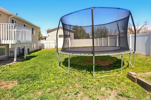 680 S Riverwalk Pkwy W, Logan, UT 84321 - view of yard with a fenced backyard and a trampoline