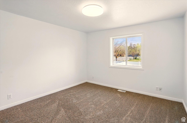 680 S Riverwalk Pkwy W, Logan, UT 84321 - spare room with baseboards, visible vents, and carpet
