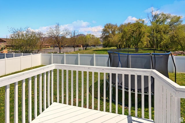 680 S Riverwalk Pkwy W, Logan, UT 84321 - wooden deck featuring a lawn and a fenced backyard