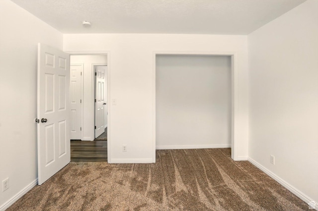 680 S Riverwalk Pkwy W, Logan, UT 84321 - unfurnished bedroom with baseboards and carpet