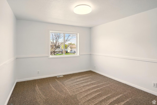 680 S Riverwalk Pkwy W, Logan, UT 84321 - carpeted empty room with baseboards and visible vents