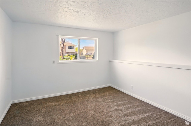 680 S Riverwalk Pkwy W, Logan, UT 84321 - unfurnished room with carpet floors, a textured ceiling, and baseboards