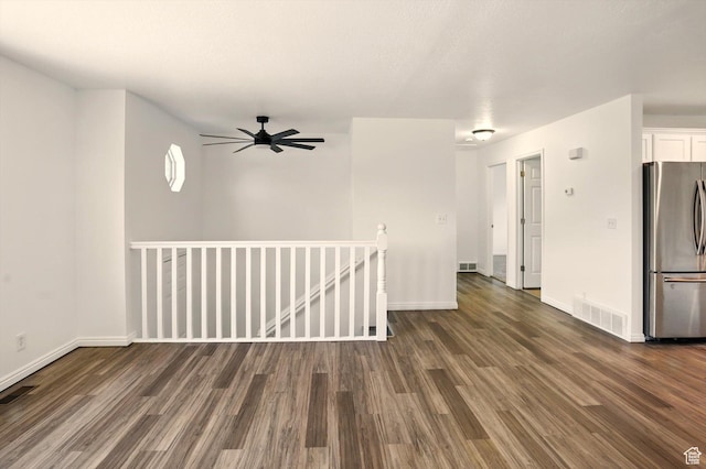 680 S Riverwalk Pkwy W, Logan, UT 84321 - unfurnished room with baseboards, wood finished floors, and visible vents