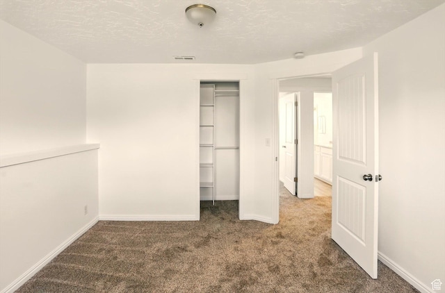 680 S Riverwalk Pkwy W, Logan, UT 84321 - unfurnished bedroom with a closet, baseboards, carpet flooring, and visible vents