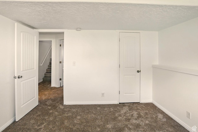 680 S Riverwalk Pkwy W, Logan, UT 84321 - unfurnished room with a textured ceiling, baseboards, and carpet