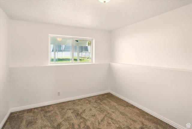 680 S Riverwalk Pkwy W, Logan, UT 84321 - spare room with carpet floors and baseboards
