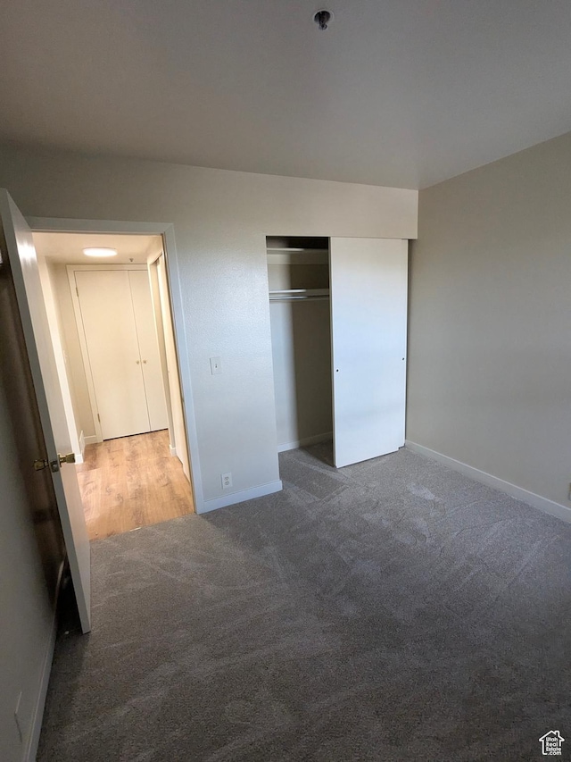 6871 N 2200 W Unit 8L, Park City, UT 84098 - unfurnished bedroom featuring baseboards, carpet flooring, and a closet