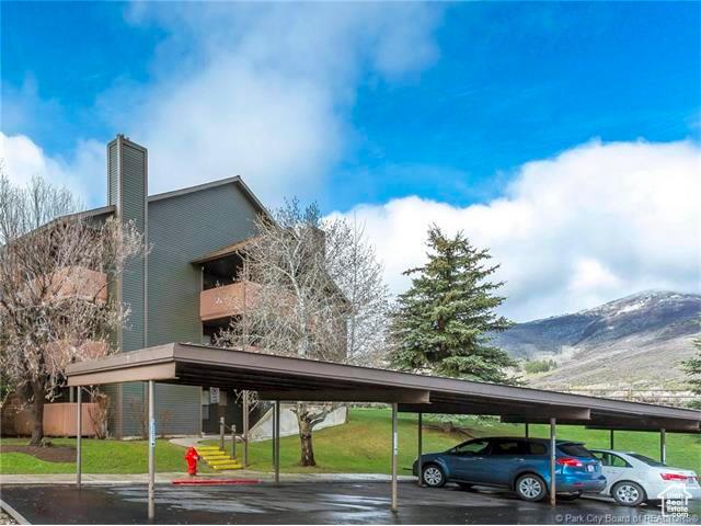 6871 N 2200 W Unit 8L, Park City, UT 84098 - covered parking lot featuring a mountain view