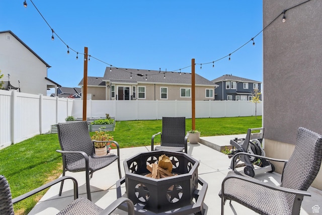 2471 W Anne Ave, West Haven, UT 84401 - view of patio / terrace featuring a fenced backyard, an outdoor fire pit, and a residential view