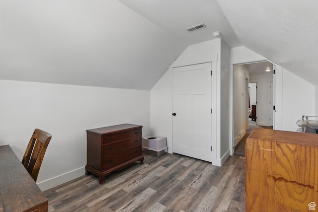 2471 W Anne Ave, West Haven, UT 84401 - office featuring baseboards, vaulted ceiling, wood finished floors, and visible vents