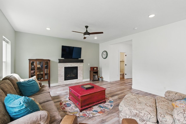 2471 W Anne Ave, West Haven, UT 84401 - living area featuring a fireplace, a ceiling fan, and wood finished floors