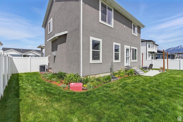 2471 W Anne Ave, West Haven, UT 84401 - back of house featuring a yard, a patio, a fenced backyard, and stucco siding