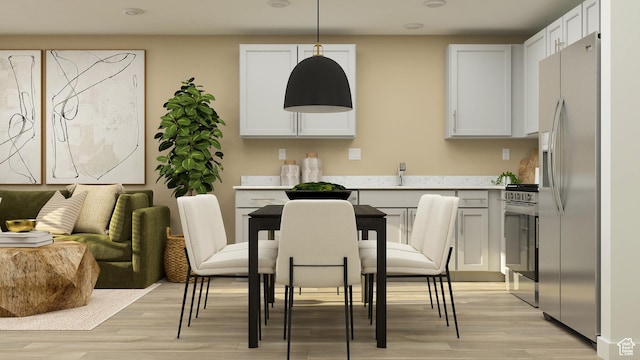 207 N Madison Ave E Unit 124, Santaquin, UT 84655 - dining area with light wood-style floors