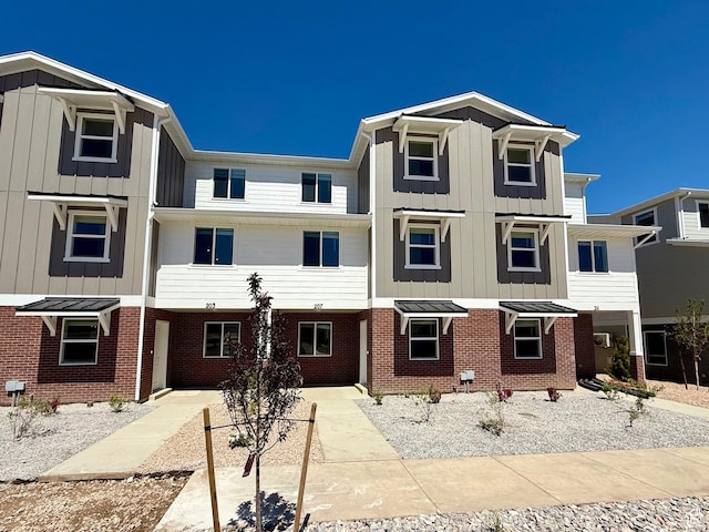 207 N Madison Ave E Unit 124, Santaquin, UT 84655 - townhome / multi-family property with board and batten siding and brick siding