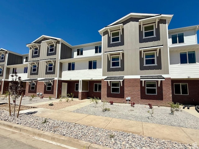 207 N Madison Ave E Unit 124, Santaquin, UT 84655 - multi unit property featuring brick siding and board and batten siding