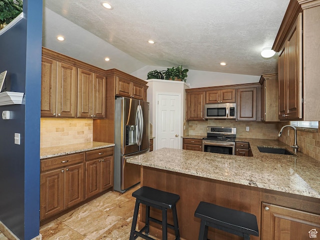 2777 W 1100 N, Layton, UT 84041 - kitchen featuring light stone countertops, a sink, stainless steel appliances, a peninsula, and vaulted ceiling