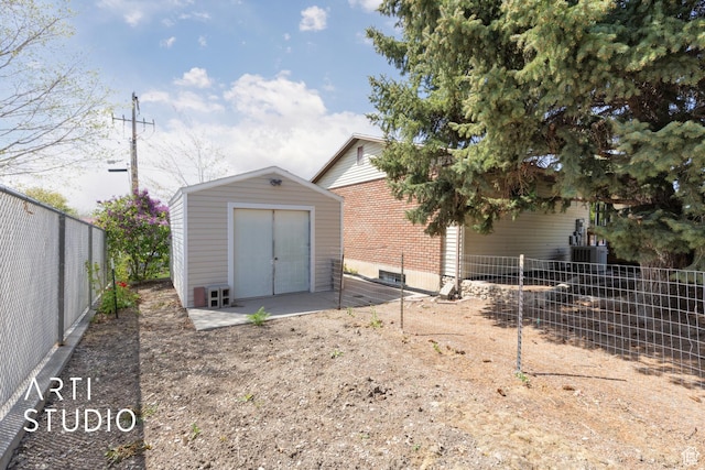 970 N 500 E, Pleasant Grove, UT 84062 - exterior space with brick siding, a fenced backyard, a storage shed, and an outdoor structure