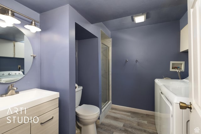 970 N 500 E, Pleasant Grove, UT 84062 - bathroom featuring vanity, wood finished floors, toilet, washer and clothes dryer, and a stall shower