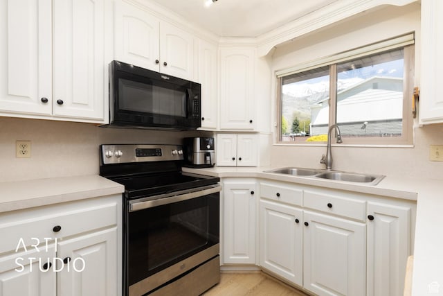 970 N 500 E, Pleasant Grove, UT 84062 - kitchen featuring a sink, black microwave, light countertops, white cabinets, and electric stove