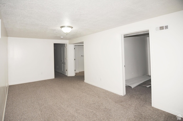 536 S Brinker E, Ogden, UT 84404 - unfurnished bedroom with baseboards, carpet flooring, a textured ceiling, and visible vents