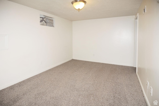 536 S Brinker E, Ogden, UT 84404 - empty room with carpet floors, a textured ceiling, and visible vents