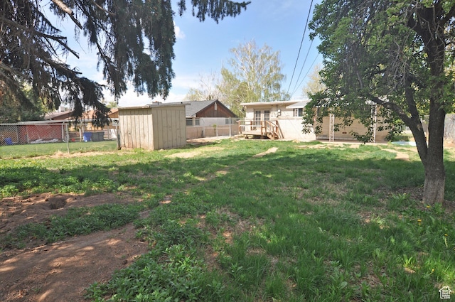536 S Brinker E, Ogden, UT 84404 - view of yard featuring an outbuilding, a shed, and a fenced backyard