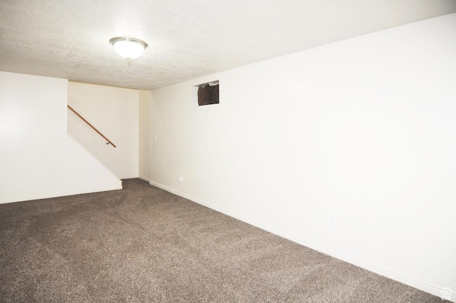 536 S Brinker E, Ogden, UT 84404 - finished below grade area with baseboards, carpet flooring, a textured ceiling, and stairs