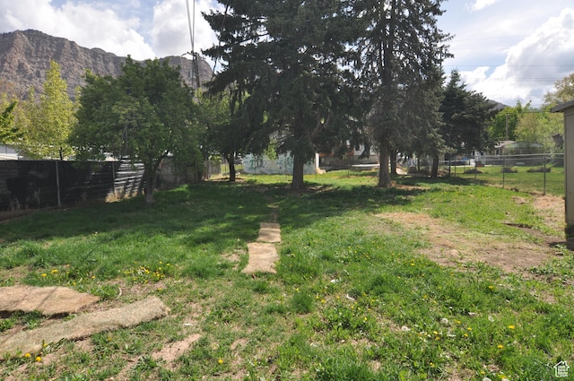 536 S Brinker E, Ogden, UT 84404 - view of yard featuring fence and a mountain view