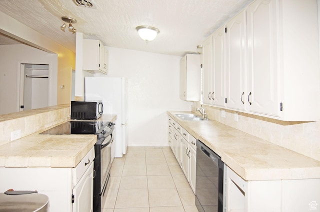 536 S Brinker E, Ogden, UT 84404 - kitchen with a sink, black dishwasher, white cabinets, tasteful backsplash, and electric stove