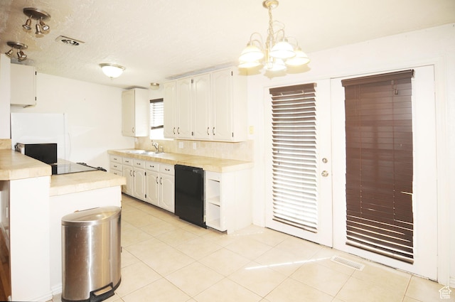 536 S Brinker E, Ogden, UT 84404 - kitchen featuring an inviting chandelier, black dishwasher, white cabinets, a sink, and light tile patterned floors