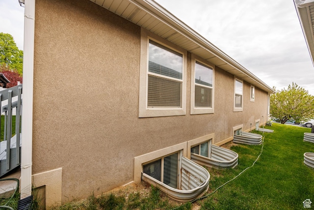 680 Stonne Ln, Kaysville, UT 84037 - view of property exterior featuring stucco siding and a yard
