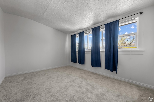 779 S 400 E, Salt Lake City, UT 84111 - carpeted spare room with a healthy amount of sunlight, baseboards, and a textured ceiling