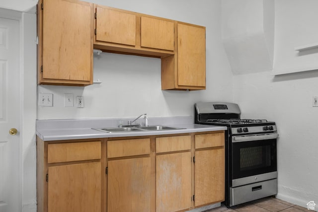 779 S 400 E, Salt Lake City, UT 84111 - kitchen with a sink, light countertops, stainless steel gas range oven, and light tile patterned floors