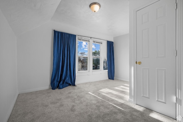 779 S 400 E, Salt Lake City, UT 84111 - unfurnished bedroom with carpet floors, baseboards, and lofted ceiling